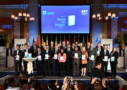Invited dignitaries hold copies of OPEC’s new World Oil Outlook