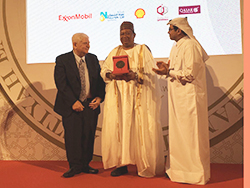HE Mohammad Sanusi Barkindo, OPEC Secretary General (c), receives the award in Doha, Qatar