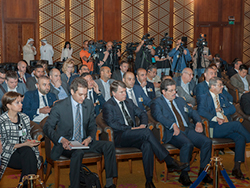 Media and other officials attend the press conference